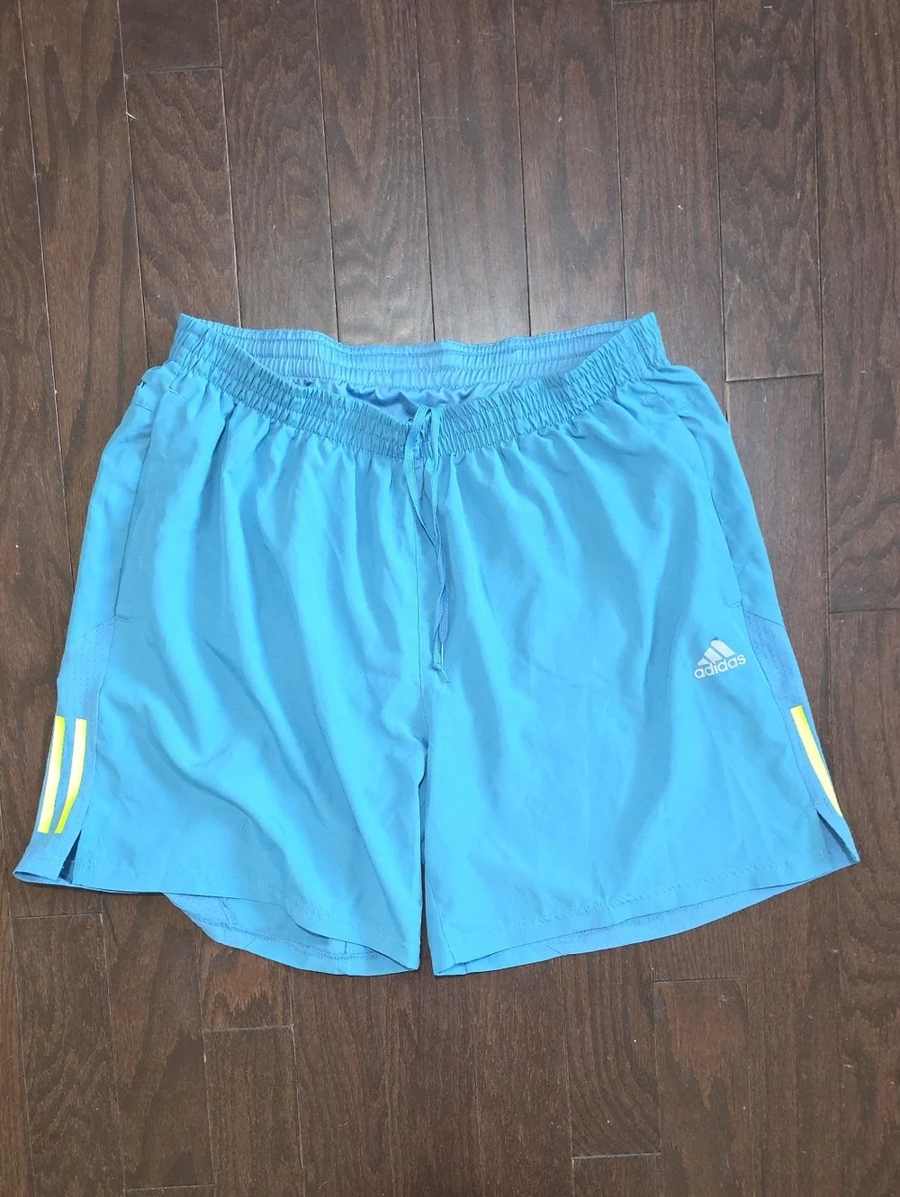 adidas Men's Light Blue Athletic Shorts with Yellow Accent